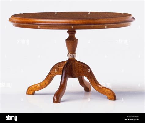 Round wooden coffee table, side view Stock Photo - Alamy