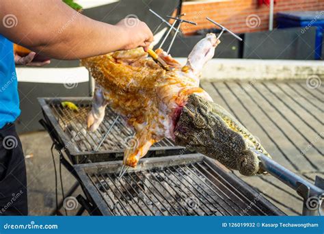 Thai Street Food ,Fried Crocodile Meat on a Barbeque for Sale ,Alligator Cooking and Roasting in ...