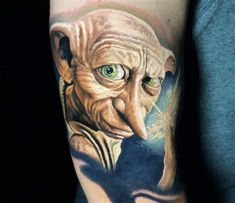 Dobby tattoo by Steve Butcher | Post 28091 | Harry potter tattoos, Tattoos, Dobby