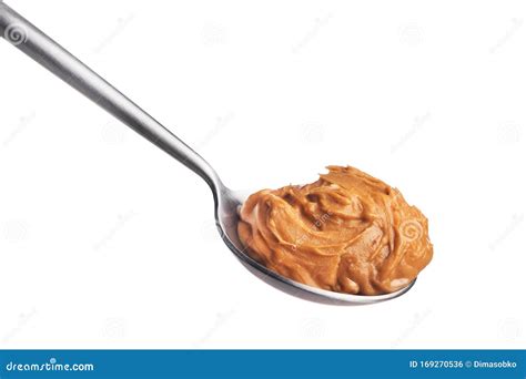 Peanut butter on a spoon stock photo. Image of food - 169270536