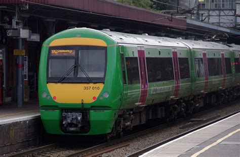 British Rail Class 357 "Electrostar" c2c Class 357010 green livery at Upminster Station for ...