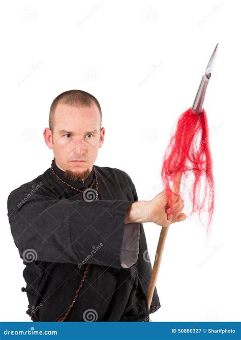 Martial Arts Teacher With Spear In Fighting Pose Stock Photo - Image: 50880327