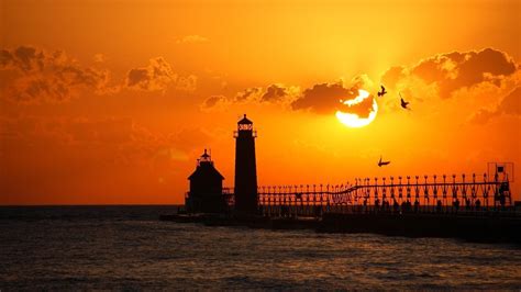 Grand Haven South Pier Lighthouses at sunset wallpaper - backiee