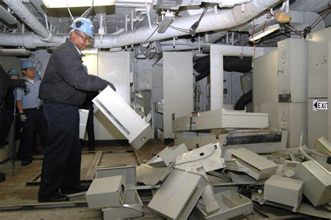 File:US Navy 060319-N-0380T-002 Petty Officer 3rd Class Chris Jones places a drawer from a ...
