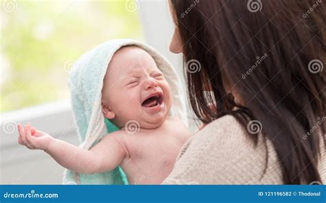 Mother and crying baby stock photo. Image of towel, baby - 121196582