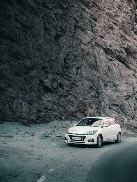 A Car on a Dirt Road · Free Stock Photo