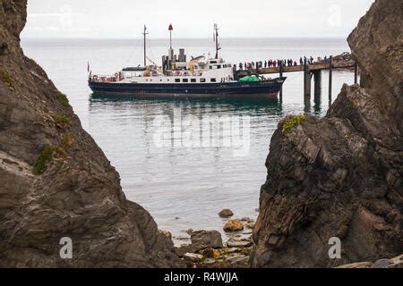 The MS Oldenburg, the Lundy island ferry, berthed on lundy island, with passengers, North Devon ...