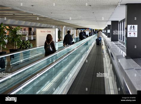 passengers on moving walkway at San Francisco International Airport California USA Stock Photo ...