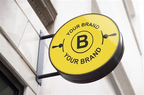 a yellow sign hanging from the side of a building that says your brand is your brand