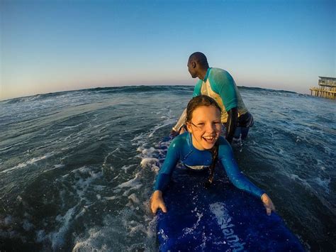 Learning to surf with Ocean Adventures, Durban beach front. KwaZulu Natal, South Africa ...