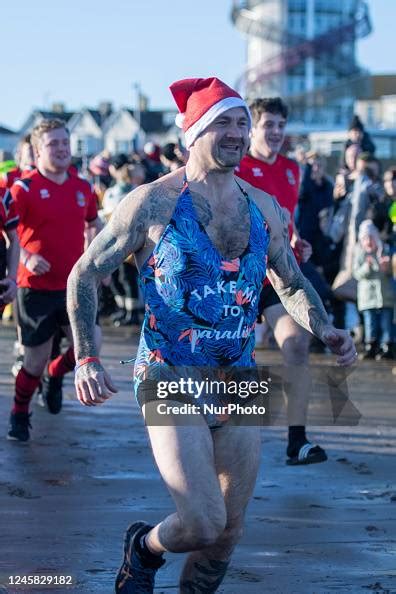 Annual Boxing Day charity dip in the North Sea at Redcar in England ...