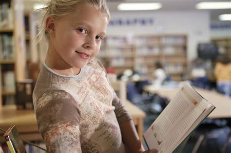 Girl reading book in library Free Photo Download | FreeImages