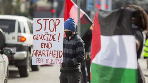 Pro-Palestine protestors descend on Oscars waving signs and flags as stars arrive for red carpet ...