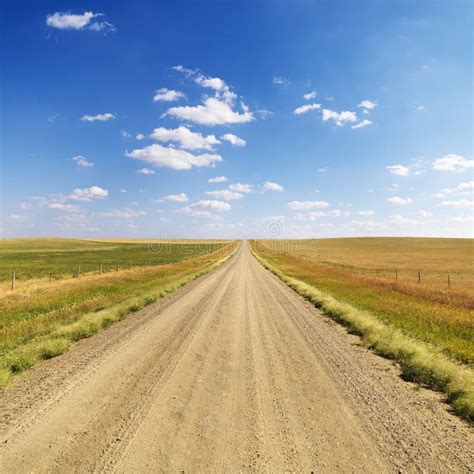 Country Dirt Road Between Fields Stock Image - Image: 12959695