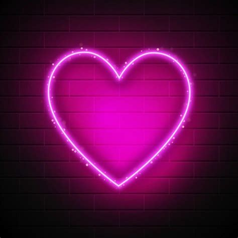 Neon Heart on Brick Wall