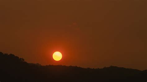 Timelapse of dramatic sunrise with orange sky in a sunny day. 37978388 Stock Video at Vecteezy