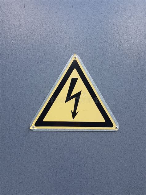 Yellow Sign `Danger, High Voltage` Stock Photo - Image of blue, antique ...