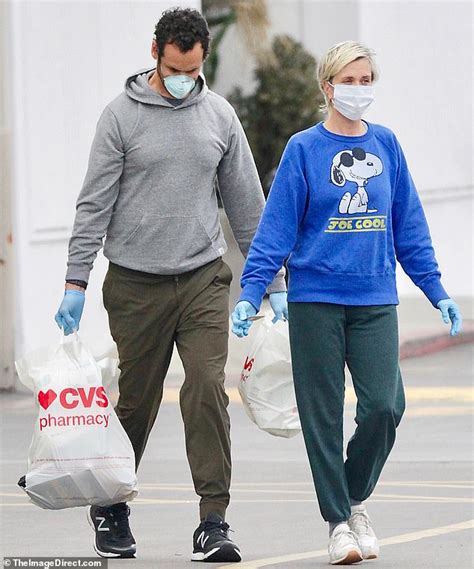 Kristen Wiig wears a mask and gloves as she stocks up on essentials ...