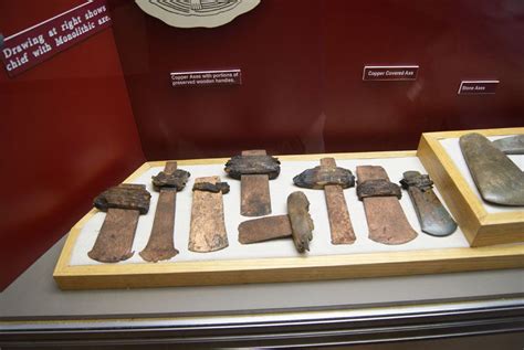 Copper axe blades and copper-covered stone axe, from Etowah Mounds, Georgia, ca. 1100-1400 ...