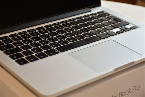 Macbook Pro on Table · Free Stock Photo