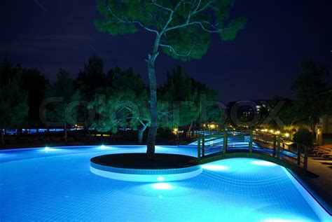 Illuminated swimming pool and bridges at night | Stock Photo | Colourbox