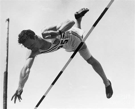 Bob Richards Going Over Pole Vault by Bettmann