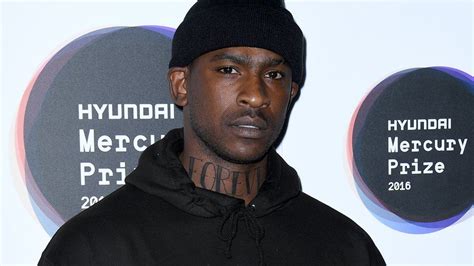 Skepta's 12 Tattoos & Their Meanings - Body Art Guru