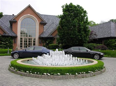 Driveway with Fountain | Home fountain, Circle driveway landscaping, Circle driveway