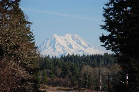 View of Mt. Rainier from the very small town of Rainier, WA | Natural landmarks, Small towns ...