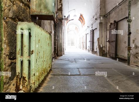 Old prison hallway. Prison hallway with light at the end Stock Photo ...