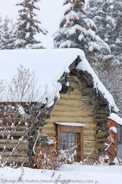 Log cabin in falling snow | AlaskaPhotoGraphics.com