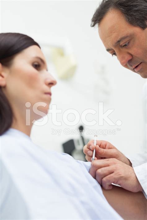 Doctor Doing An Injection To A Patient Stock Photo | Royalty-Free | FreeImages