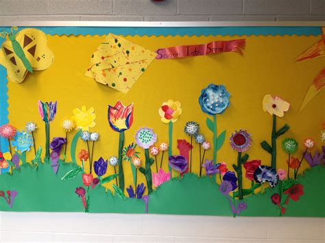 Spring flower bulletin board. Pre school children made flowers from assorted media. Flower ...