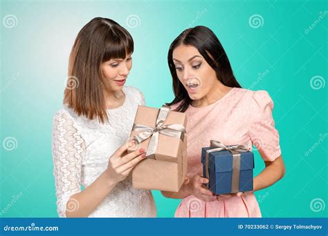 Friends exchanging gifts stock photo. Image of beautiful - 70233062