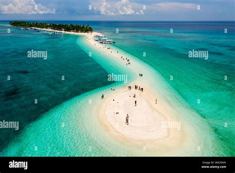 Aerial drone view of a beautiful tropical island with sandy beach ...