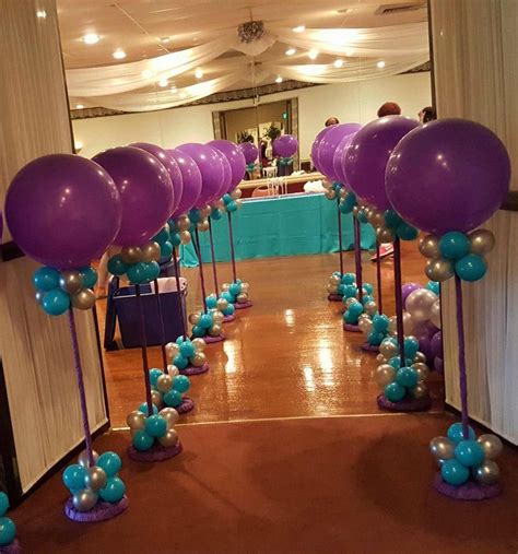 Silver, Purple and Teal Balloon Topiaries lined up along the entrance ...