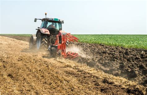 Tractor plowing field stock image. Image of season, countryside - 64391363