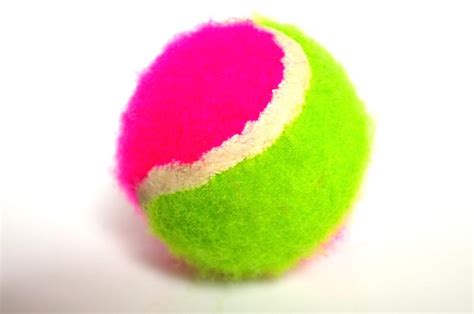 Tennis | Free Stock Photo | A pink and green tennis ball isolated on a white background | # 6507