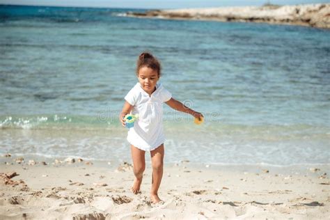 Adorable Little Girl Splashing in Tropical Shallow Water during Summer Vacation Stock Image ...