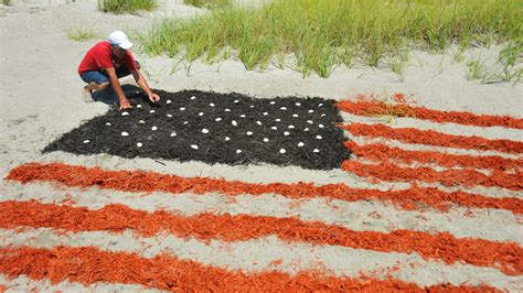 Timelapse: Watch a giant American flag being made in the sand in Cocoa Beach