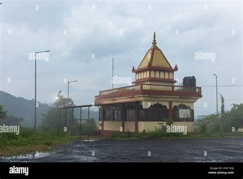 Beautiful mountain top Shankar Parvati Temple during monsoon season ...