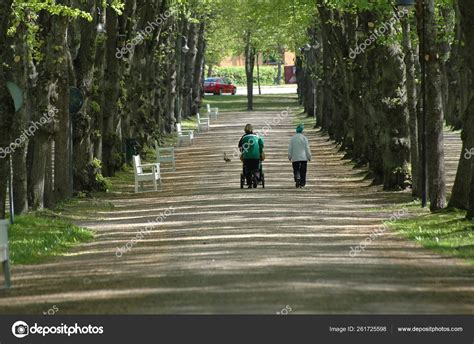 Two People Walking Park – Stock Editorial Photo © YAYImages #261725598