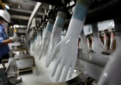 Malaysian glove maker Kossan to cut capacity after Covid-19 outbreak ...