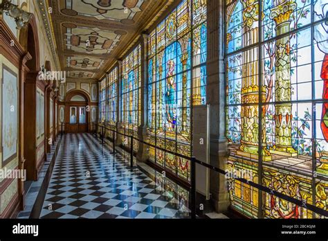 Hallway lined with ornate stain glass murals, at Chapultepec Castle, in Mexico City. Now known ...