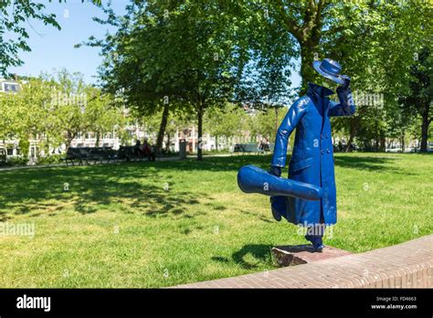 Amsterdam - June 11: The statue of a running man holding a violin case was the first statue by a ...