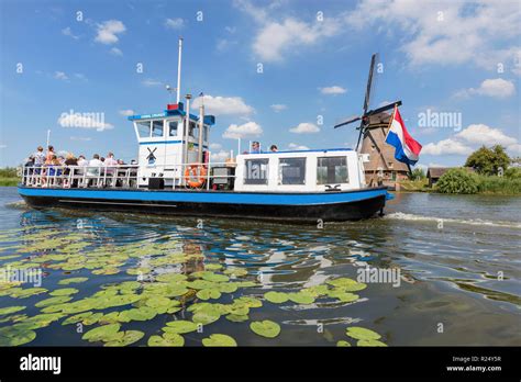 Boat Tour At Windmills Of Kinderdijk, Netherlands Stock Photo - Alamy