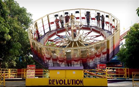 REVOLUTION : Thrill action ride, as the cage rotates you are pinned to ...