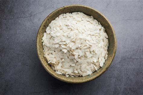 Premium Photo | Raw flattened rice or thick or thin rice flakes for ...