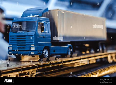 Yellow toy dump truck is isolated on the road Stock Photo - Alamy