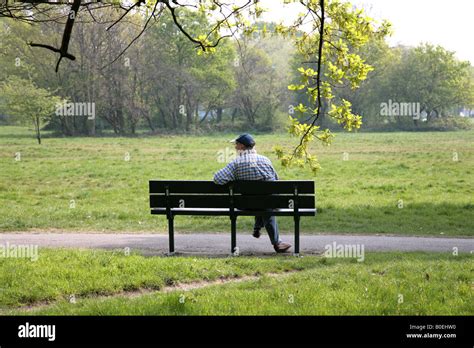 man sitting alone on park bench Stock Photo: 17531724 - Alamy